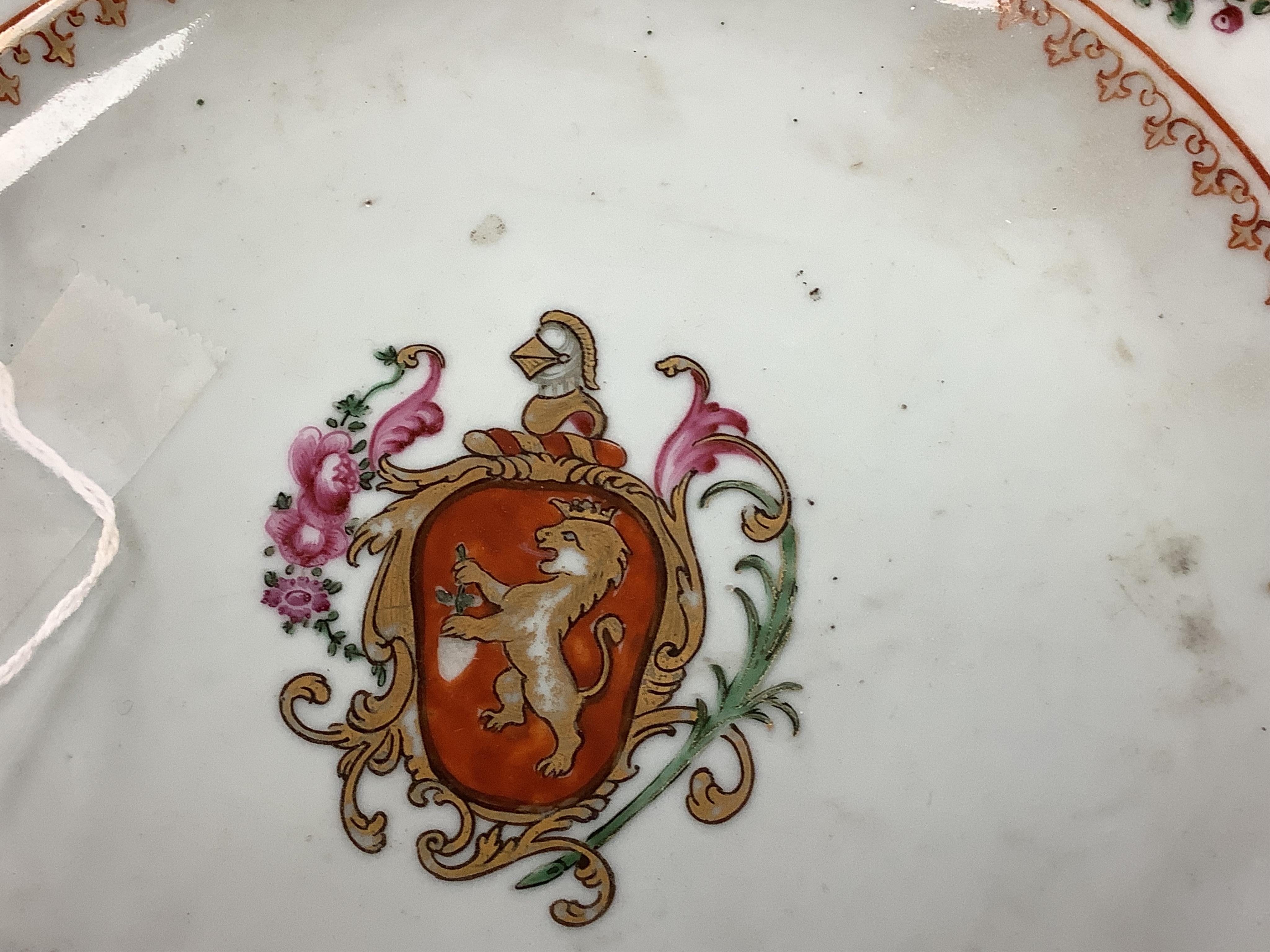 Three Chinese famille rose plates, Qianlong, including an armorial example, largest 22.5cm in diameter
